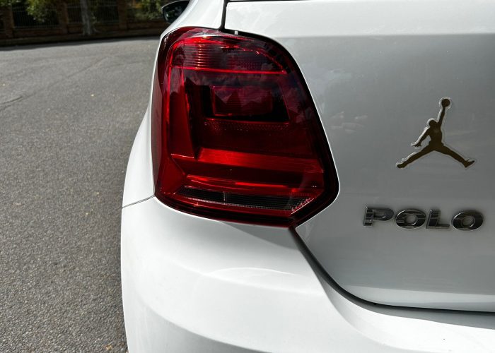 Volkswagen Polo rental Brisbane - white Polo tail light & Jordan badge close-up, Shalaby Group Mocars