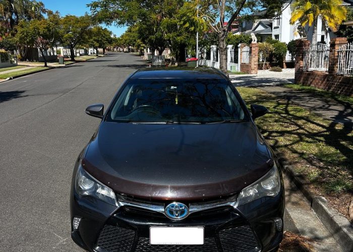 Toyota Camry Hybrid 2017 rental Brisbane - sleek dark gray fuel-efficient hybrid sedan front view, Shalaby Group