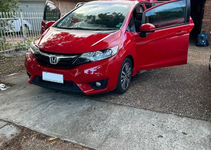 Honda Jazz 2017 rental Brisbane - red compact hatch front side open door, Shalaby Group Mocars